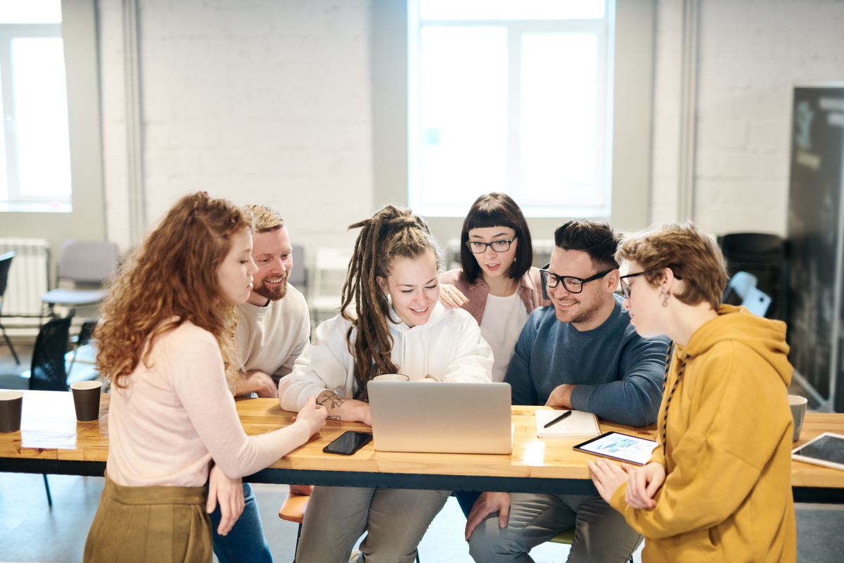 Photo Of People Looking On Laptop